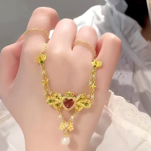 QIUPALEI | “Queen of Hearts” vintage court style necklace with delicate inlays and faux pearl embellishments for a romantic statement - Image 2